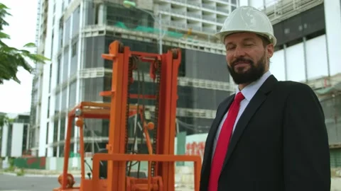 Portrait of a contented senior engineer with a beard, a construction worker at a Video stock 162335656