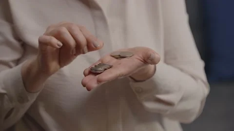 Portrait of counting coin in hand. Stock Footage 148625860
