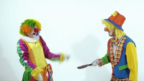 Portrait of a couple of comic circus clowns pretending kung fu fighters with Stock-Footage 70513022
