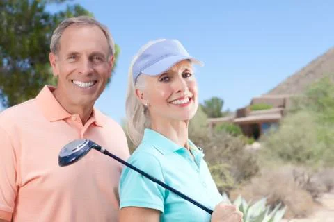 Portrait of couple on golf course Fotos Stock