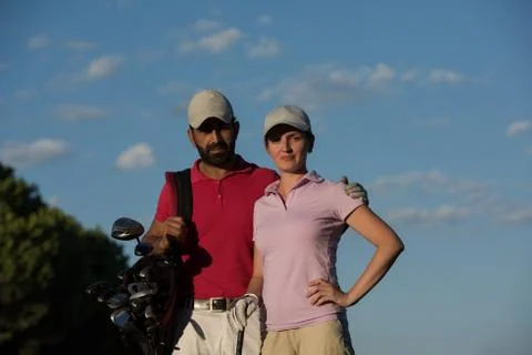 Portrait of couple on golf course Fotos de archivo
