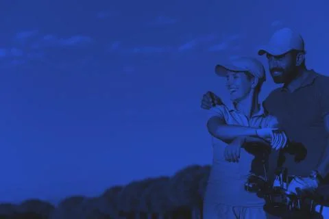 Portrait of couple on golf course Fotos de archivo