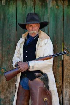 Portrait of Cowboy with Rifle, Shell, Wyoming, USA Stock Photos