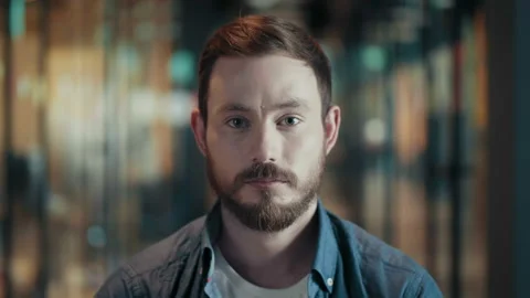 Portrait of creative young man with beard and mustache looks pensive severe look Stock Footage 93791290