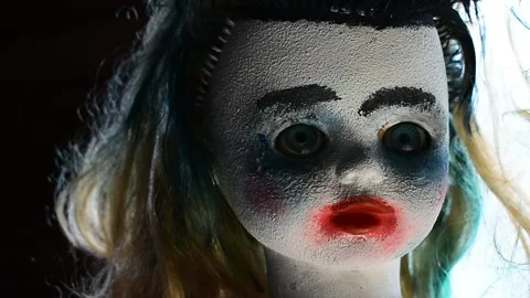 Portrait of a creepy doll at the window, close-up Stock Footage 138391002