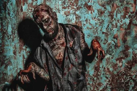A portrait of a creepy scary zombie. Halloween. Horror film. Stock Photos
