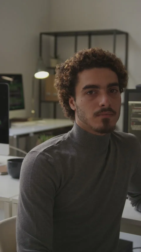 Portrait of Curly Haired Male Programmer in Office Stock Footage 255992579