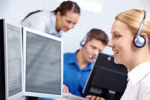 Portrait of customer representative working on the background of colleagues 스톡 사진