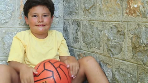 Portrait of a cute boy with ball Stock Footage 53134942