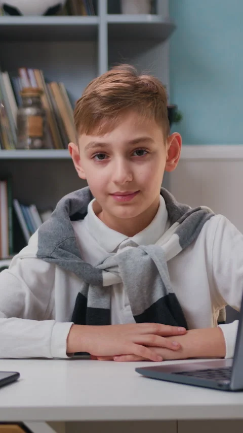 Portrait of cute boy looking in camera smiling and making funny faces, happy chi Stock Footage 331308751