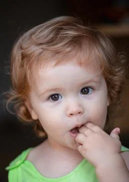 Portrait of a cute child baby. Close up caucasian kids face. Closeup head of Stock Photos