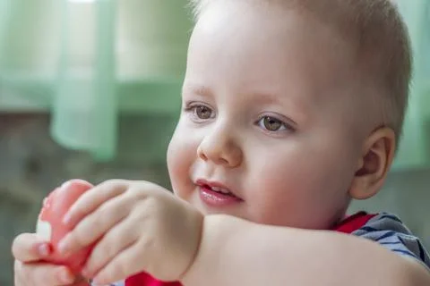 Portrait of a cute child with Easter eggs. Easter lunch. The feast of Holy Ea Stock Photos