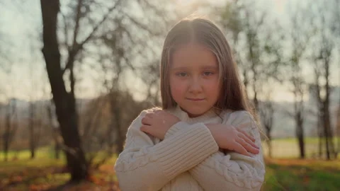 Portrait cute child looking at camera stay at autumn park outdoors Stock Footage 164734601