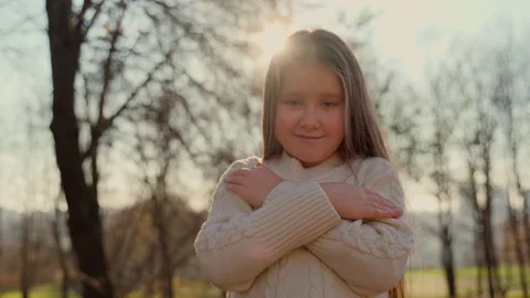 Portrait cute child looking at camera stay at autumn park outdoors Stock Footage 164741700