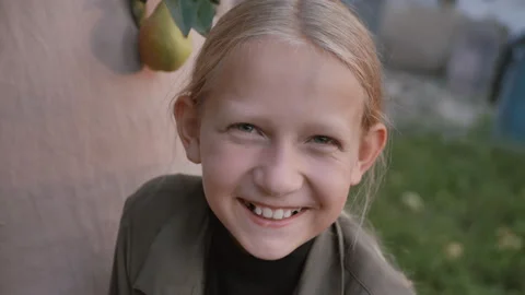 Portrait of a cute girl looking at the camera Stock Footage 189790893