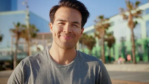 Portrait of cute guy smiling while enjoying tasty summer fruits chilling by Stock Footage 109419127