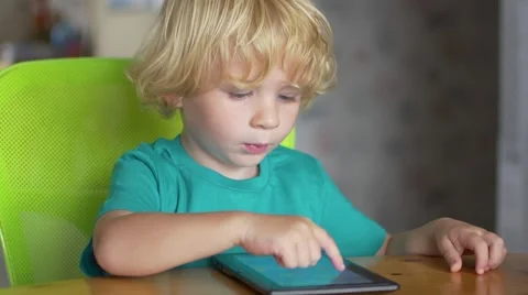 Portrait Of Cute Little Boy Using Digital Tablet 스톡 동영상 54447080
