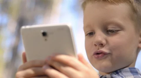 Portrait Of Cute Little Boy Using Digital Tablet Video stock 55064793