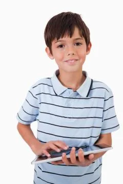 Portrait of a cute little boy using a tablet computer 스톡 사진