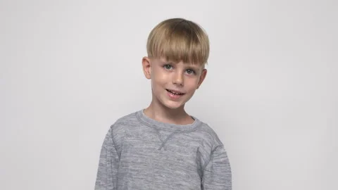 Portrait of a cute little boy on a white background Vídeo Stock 282202353
