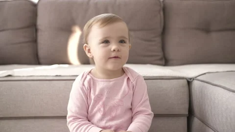 Portrait cute little kid while watching TV. Young girl watch television on Stock Footage 147971826