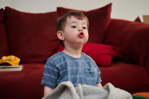 Portrait of a cute young boy and his safety blanket Stock Photos