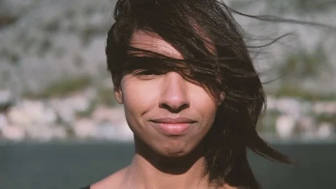 Portrait of a dark-skinned woman whose hair flies from the wind Stock Footage 76200816