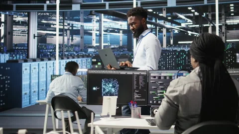 Portrait of data center engineer analyzing gear issues using node tree tool Stock Footage 307014229