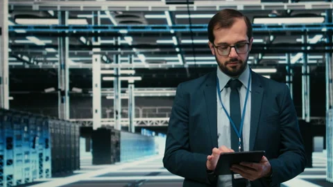 Portrait of data center engineer monitors system performance using AR simulation Stock Footage 329453338
