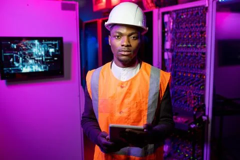 Portrait of data center engineer in orange vest Stock Photos