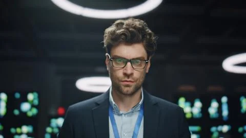 Portrait data center engineer posing at database. Serious man looking camera Stock Photos