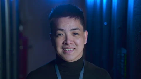 Portrait of data engineer posing for camera and smiling while standing in big Stock Footage 166837621