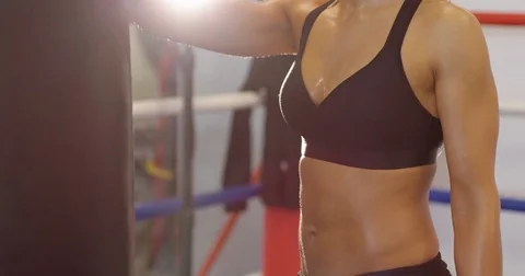 Portrait of dedicated active woman resting after workout at the boxing gym club Stock Footage