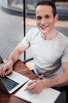Portrait of delighted man that posing on camera Stock Photos