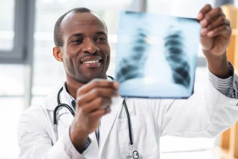 Portrait of delighted man while working Stock Photos