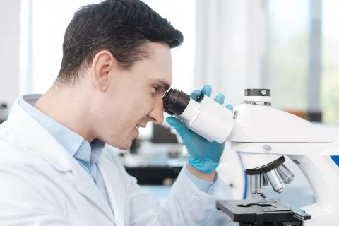 Portrait of delighted scientist while testing genetic code Stock Photos