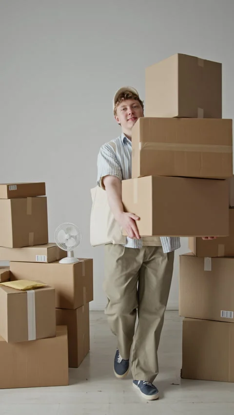 Portrait of Delivery Man Carrying Stack of Cardboard Boxes Smiling Stock Footage 342598652