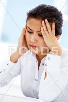 Portrait of depressed businesswoman with headache Stock Photos