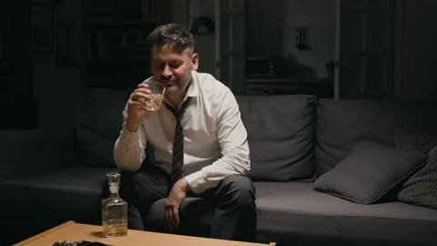Portrait of Depressed Middle Aged Man Abusing Alcohol at Home Stock Footage 344863429