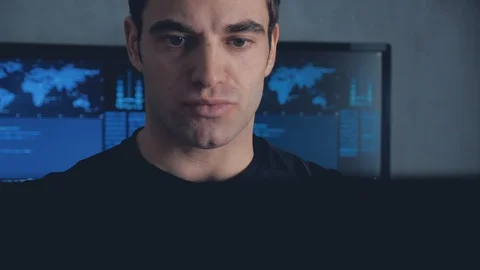 Portrait of developer programmer working on computer in a data center filled Stock Footage 102042228