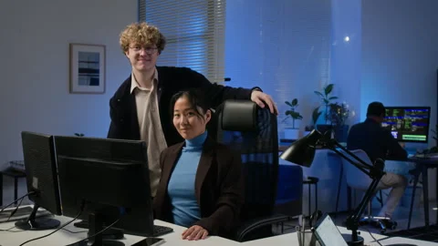 Portrait of Diverse Cybersecurity Analysts Smiling in Modern Office Stock Footage 347295470