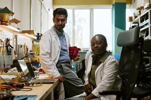 Portrait of Diverse Engineers Working in Robotics Lab 写真素材