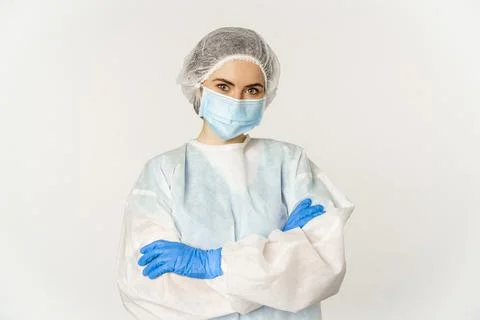 Portrait of doctor, female nurse in personal protective equipment, looking Stock Photos