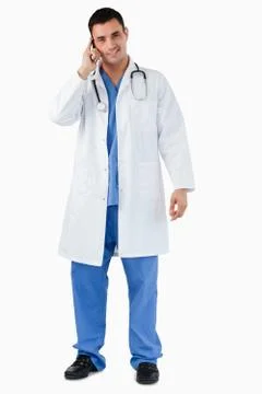 Portrait of a doctor making a phone call Stock Photos