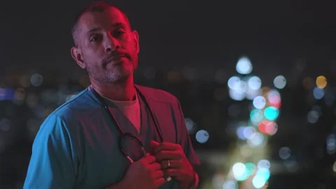 Portrait of doctor on night shift with emergency lights Stock Footage 327761233