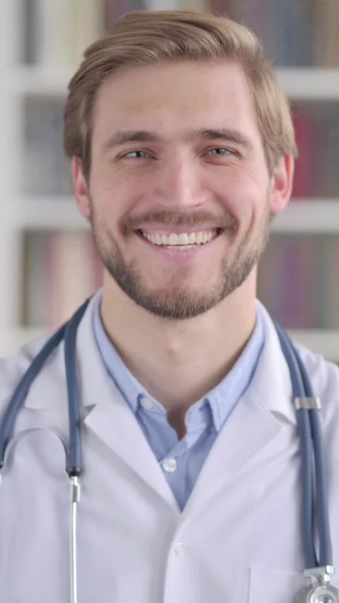 Portrait of Doctor Smiling at the Camera, Vertical Video Vídeo Stock 339577033