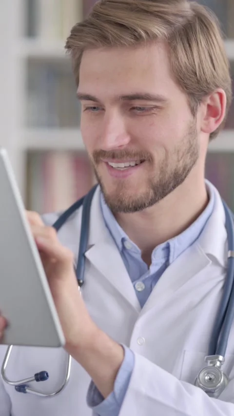 Portrait of Doctor using Digital Tablet, Vertical Video Stock Footage 339577237