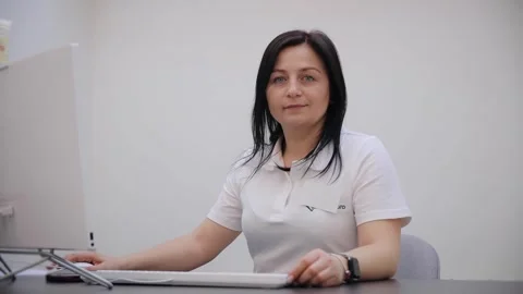 Portrait of a doctor working at the computer and looking at the camera Stock Footage 270914324