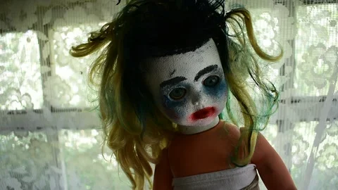 Portrait of a doll with makeup on the background of the attic window Stock Footage 148256409