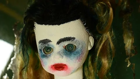 Portrait of a doll with makeup Stock Footage 148256676